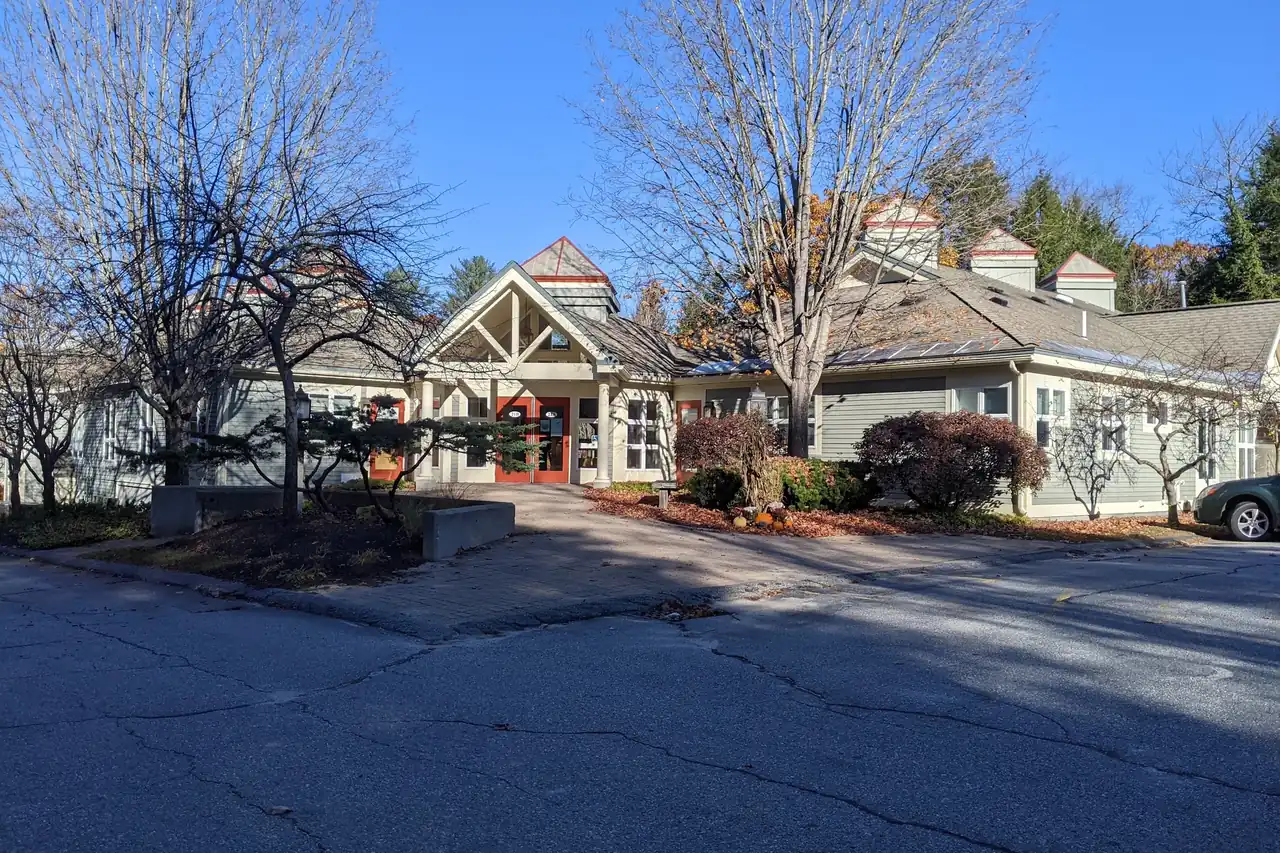The Falmouth Dental Health building on Northbrook Drive, Falmouth, Maine, on a clear autumn day.